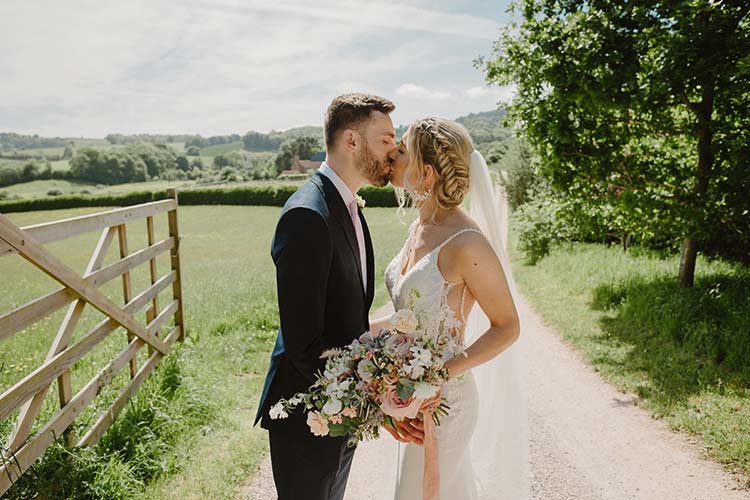 Spring wedding bride groom kiss