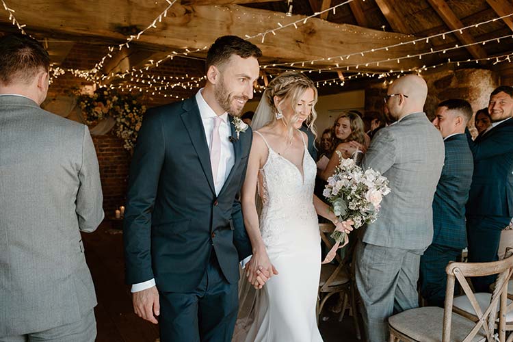 Spring wedding couple leaving venue