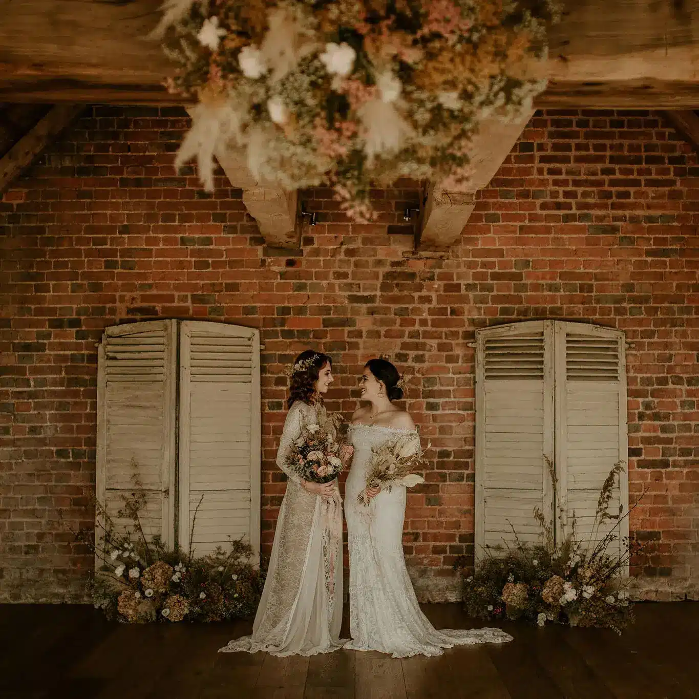 Same sex wedding venue same sex couple married inside rustic barn