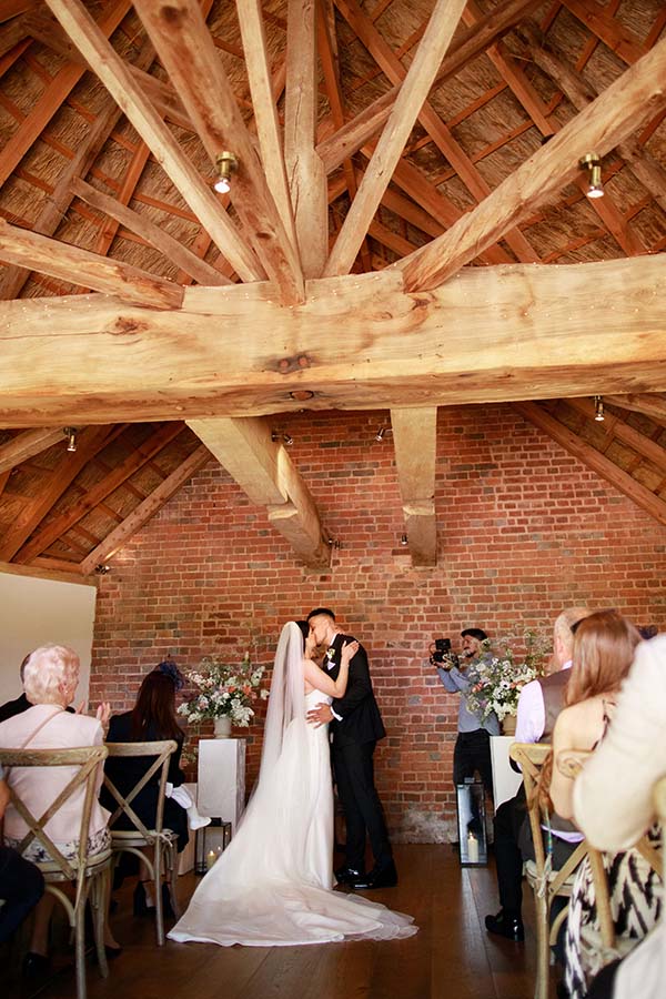 Barn Wedding Couple Kiss Ceremony