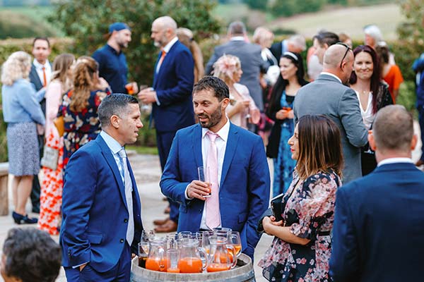 Autumn Barn Wedding Guests With Drinks