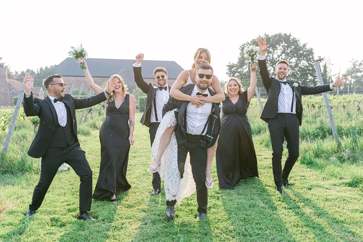 Guests And Wedding Couple Celebrate At Vineyard Wedding In Devon