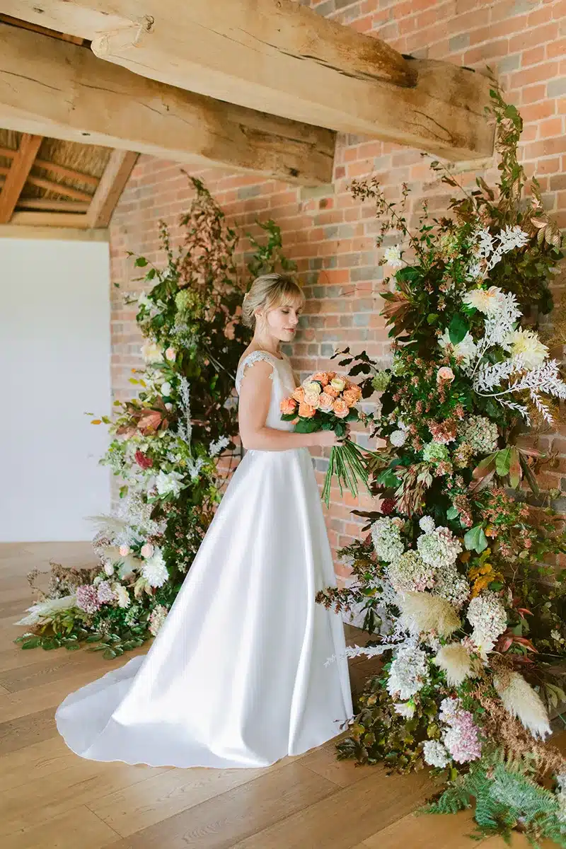 Bride Selecting Flowers For Small Wedding In Devon